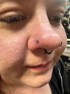 Nostril piercing by Briana