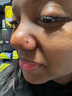 Nostril piercing by Briana