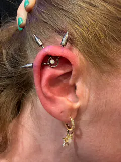 Triple Vertical Helix and Flat piercing by Briana
