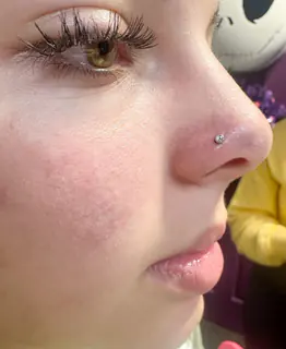 Nostril piercing by Briana