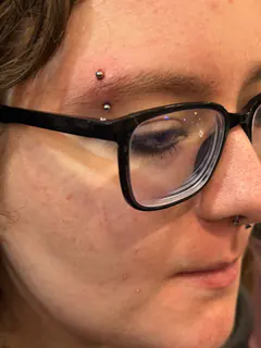 Eyebrow piercing by Briana