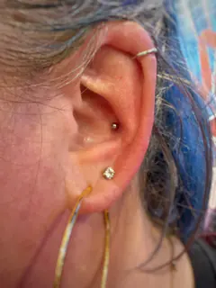 Conch piercing by Briana