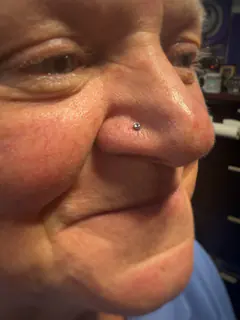 Nostril piercing by Briana