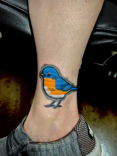 Embroidered patch-style striped creature tattoo by Dave