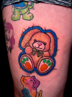 Embroidered patch-style pumpkin creature tattoo by Dave