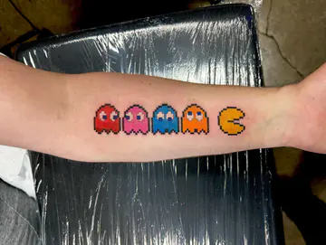 Nintendo 64 logo and Squirtle tattoo by Dave