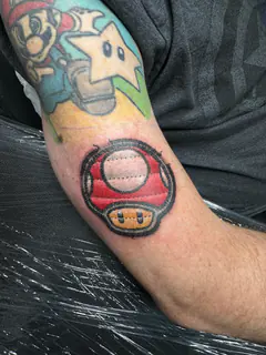 Three pixel-art heart tattoo by Dave