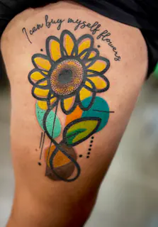 Watercolor hummingbird tattoo on a foot