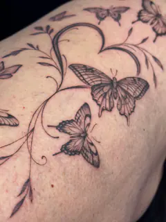 Geometric linework tattoo on a forearm