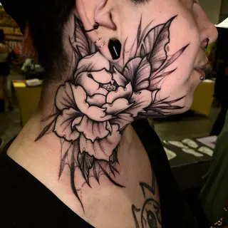 Color jellyfish tattoo on an upper arm