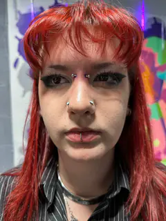 Eyebrow and septum piercings completed by Mikey