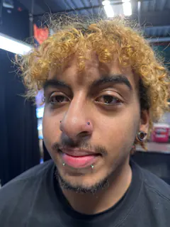 Nose and lip piercings completed by Mikey